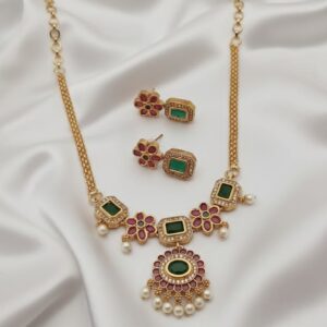 simple gold plated necklace set with green & pink stones, pearls & floral accents
